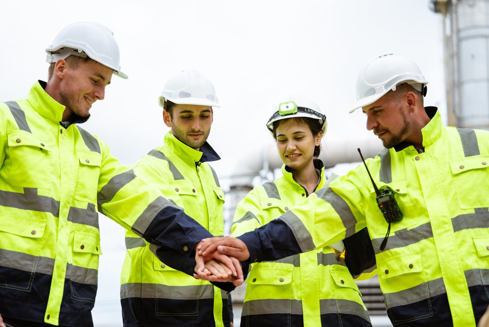 group of engineer stacking hand in unity, symbolizing teamwork a